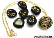 Picture of Black Sanskrit Tumble stone set with golden cage necklace
